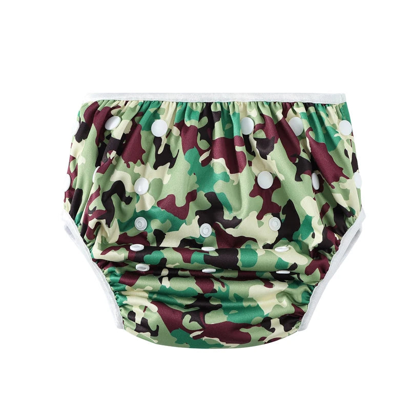 Reusable baby cloth diaper with adjustable snap buttons in green camouflage print design.