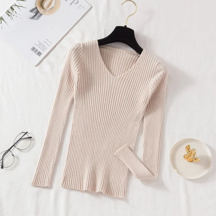 Tidesmit beige long-sleeve ribbed knit sweater with a V-neckline, shown hanging against a white background.