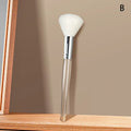 Soft white facial cleansing brush with a transparent handle for face masks and gentle skin care massage.