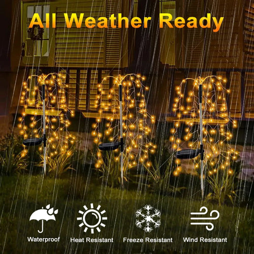 Three solar-powered firecracker stake lights with warm yellow LED lights glowing in a rain-soaked garden.