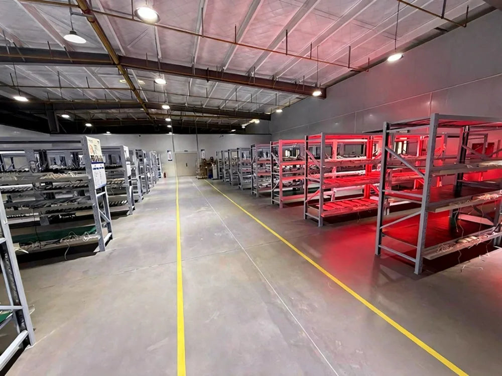 GOVW neurofeedback device manufacturing warehouse with red light RTMS therapy units on industrial metal shelving.