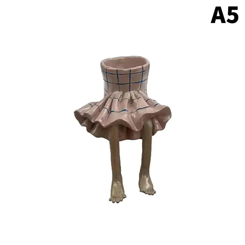 Beige-and-gray checkered leggy resin planter with ruffled skirt and standing legs