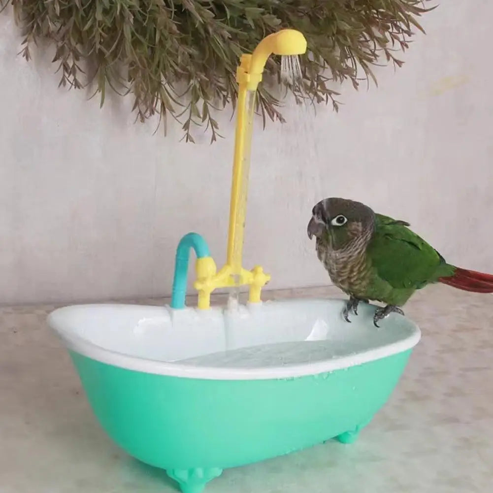 Green parrot bathing in an automatic plastic bird shower tub with a yellow faucet for fun, mess-free pet hygiene.