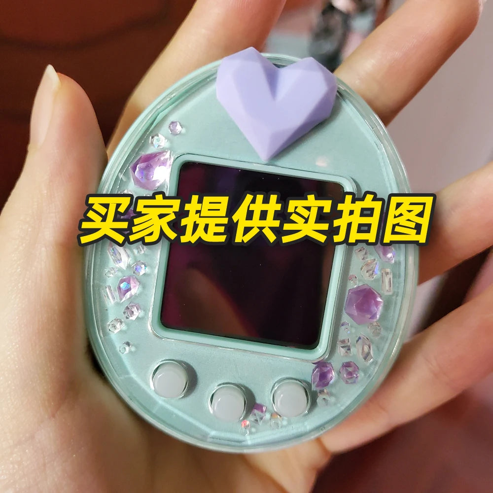 Tamagotchi Uni hard shell case with purple silicone heart dust plug for protection and stylish electronic pet decoration.