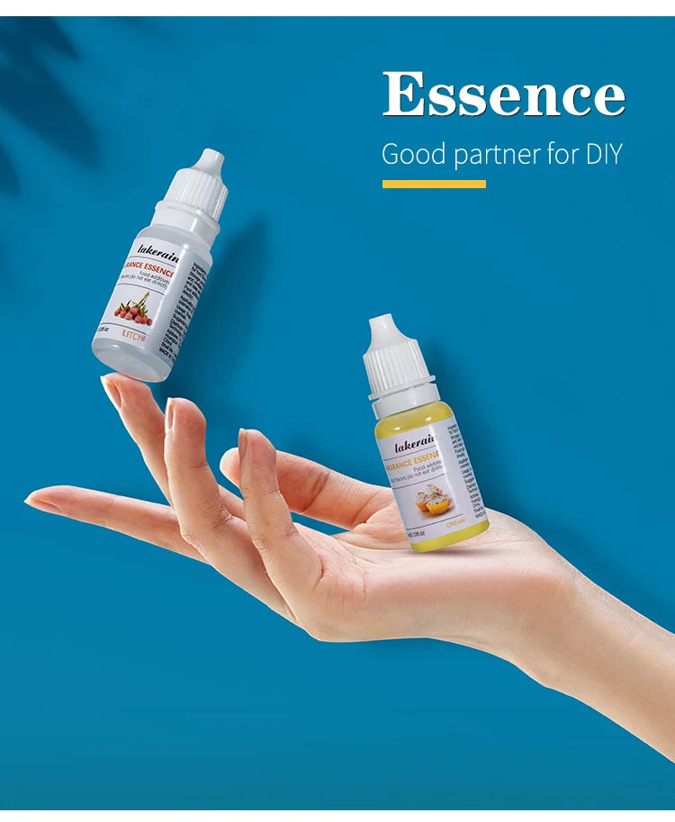 Two 10ml Lakerain fruit fragrance oil bottles for DIY lip gloss and soap making held in a hand.