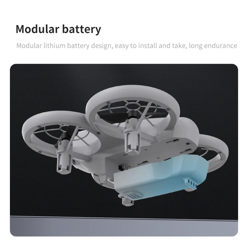Small white drone with a detachable light blue modular lithium battery pack on its underside.