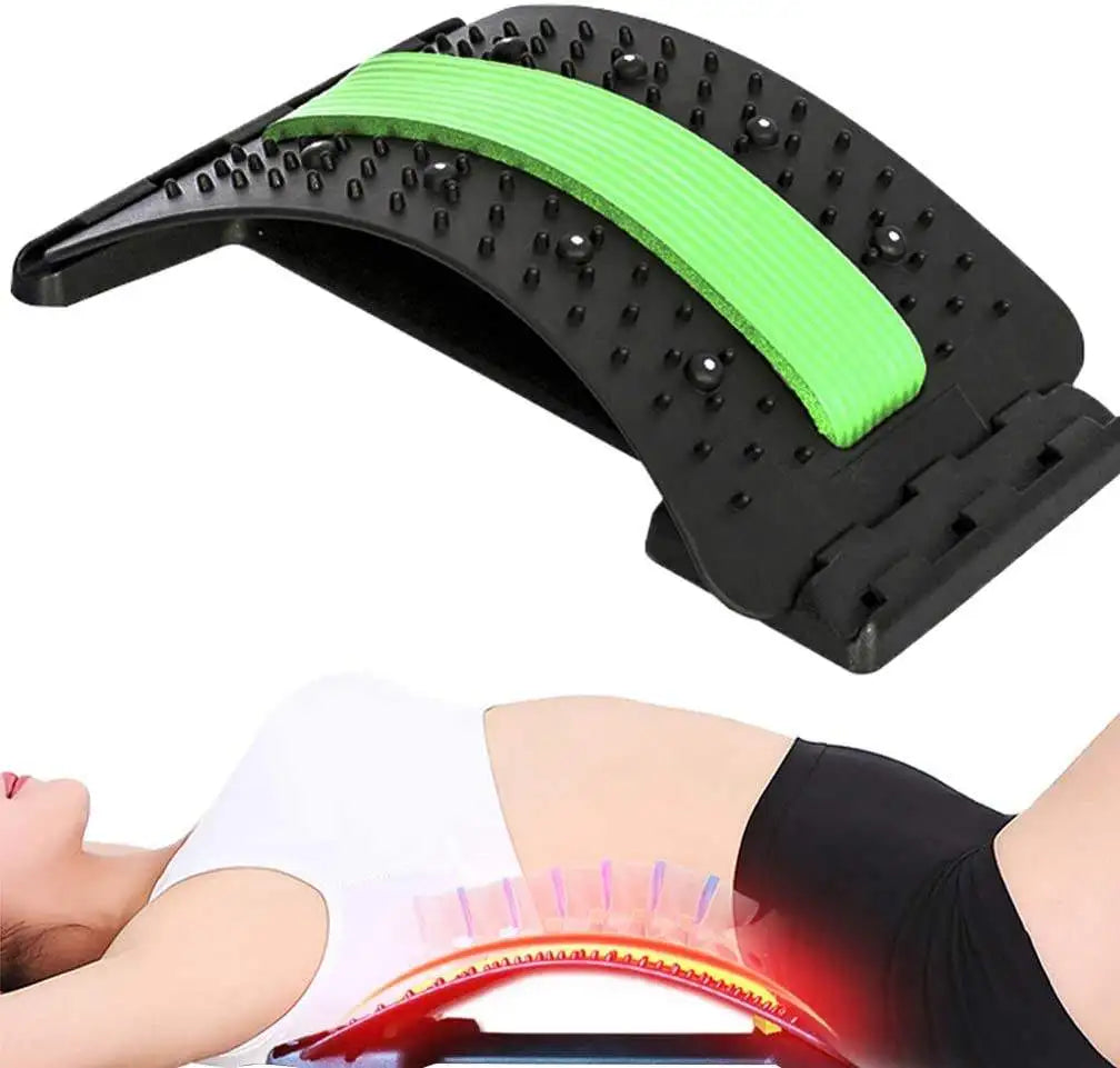 Black plastic back stretcher with a green foam spine strip and acupressure nubs for lumbar pain relief and support.