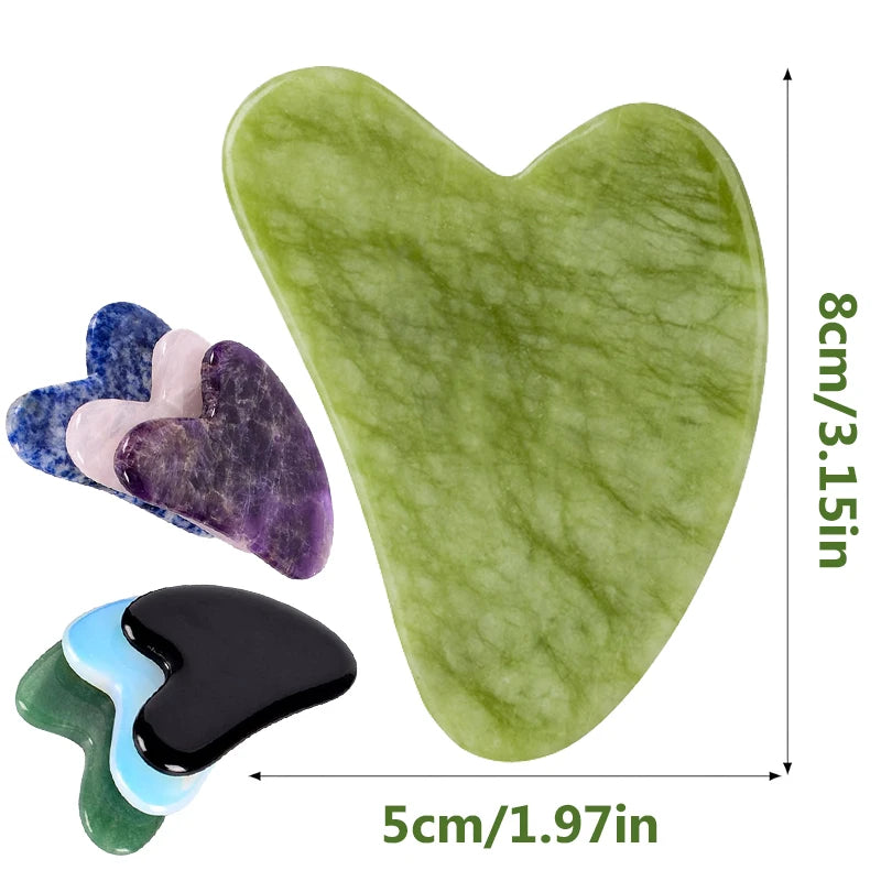 Heart-shaped stone gua sha massagers in various colors and polished natural stone materials, labeled with dimensions.