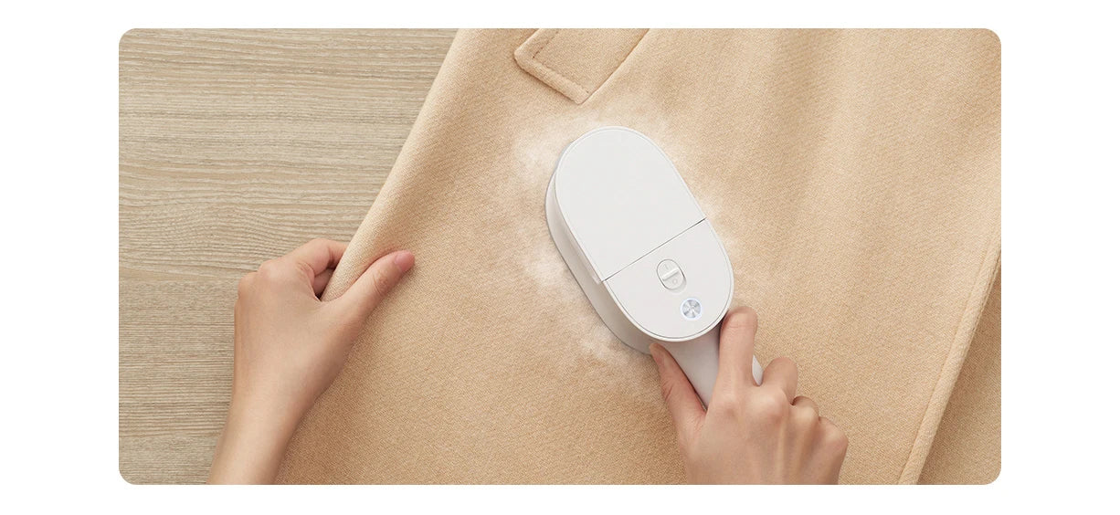 Tidesmit portable handheld garment steamer for clothes showing vertical steaming nozzle and ergonomic handle design