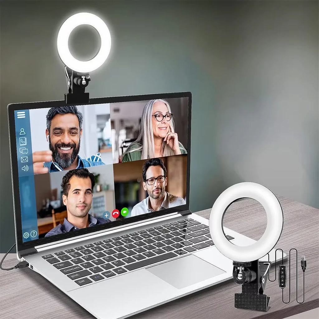 Small circular LED ring light with a black clip-on mount, used for improved video call lighting on a laptop.