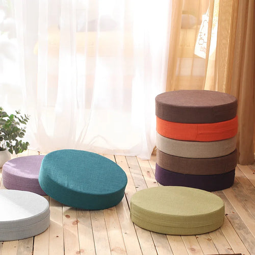 Round linen meditation cushions in assorted colors for mindful sitting practice and yoga.