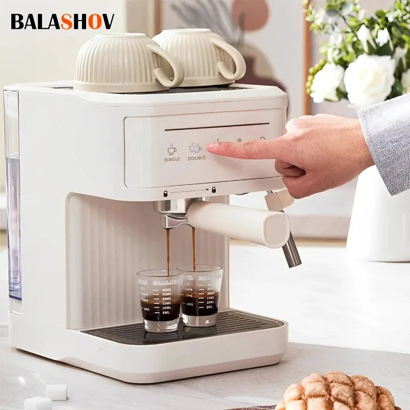 BALASHOV white compact espresso machine brewing two shots into glass measuring cups with top cup warmer feature.