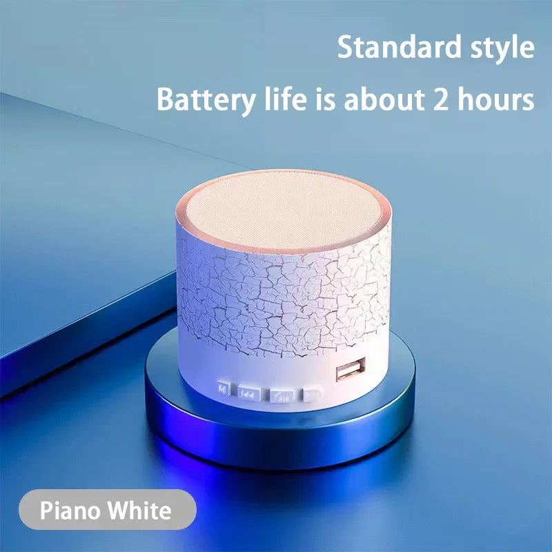 Portable Bluetooth speaker with white crack-texture body and beige top panel