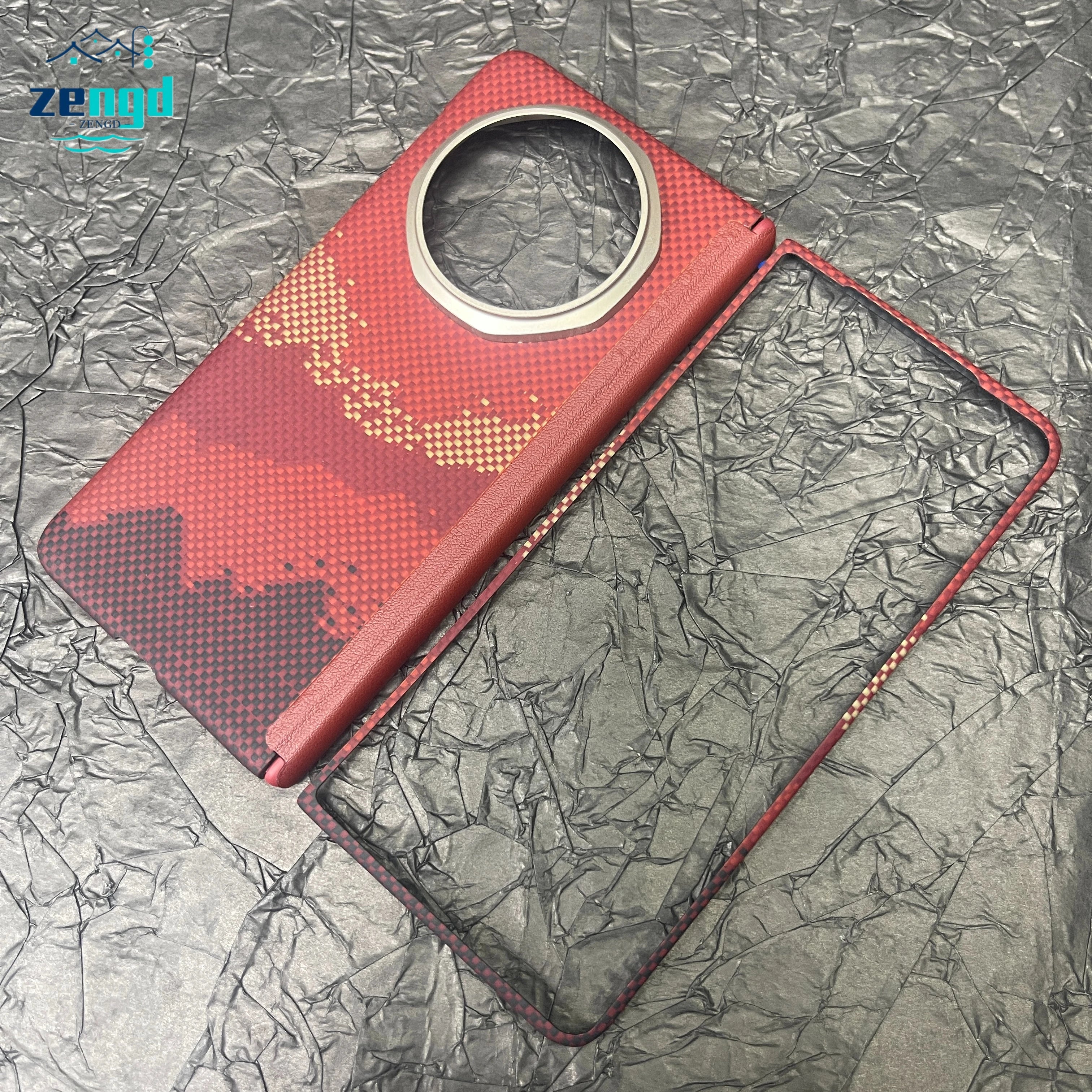 Red, carbon-fiber textured folding phone case with a large circular camera cutout, consisting of two separate pieces.