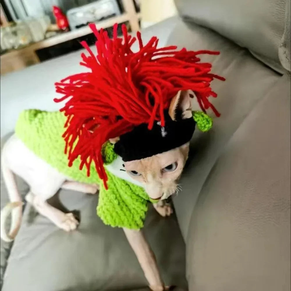 Funny knitted cat hat with red yarn hair on a hairless Sphynx cat, perfect for a cute adjustable pet cosplay costume.