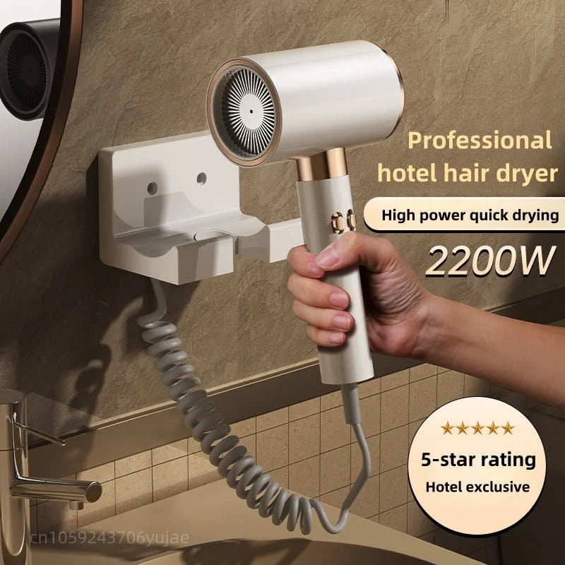 White 2200W wall-mounted hotel hair dryer with coiled cord, gold accents, and silent high-power quick-dry technology.