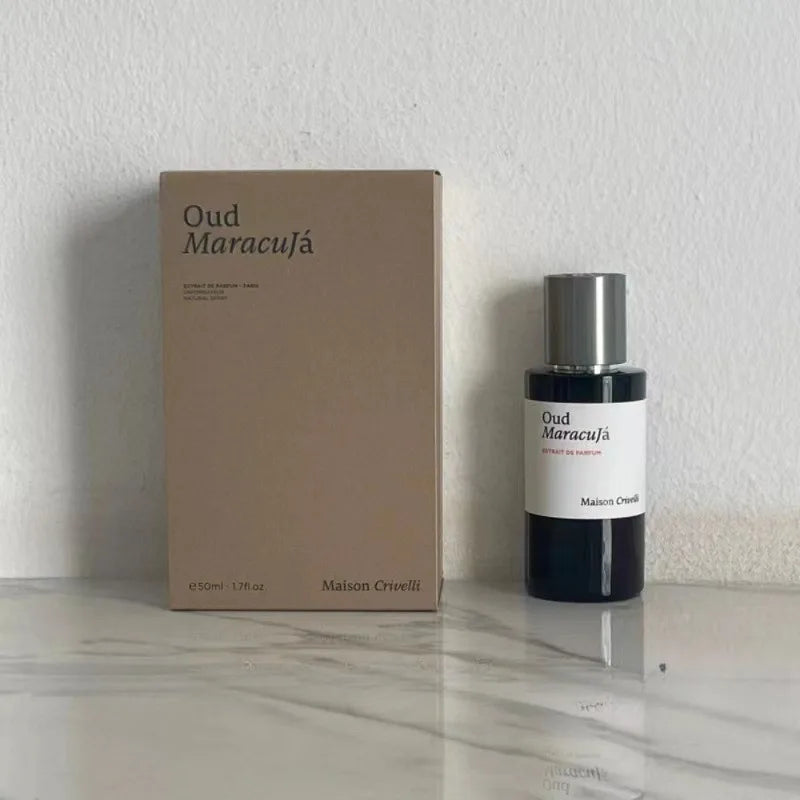 Maison Crivelli Oud Maracuja Extrait de Parfum 50ml: Luxury unisex woody-fruity fragrance in a sleek cylindrical bottle.