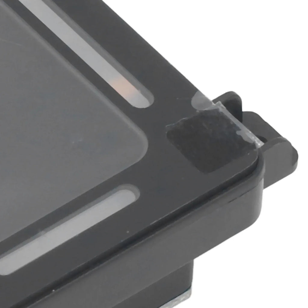 Close-up of black barcode scanner module edge with mounting bracket and front window.