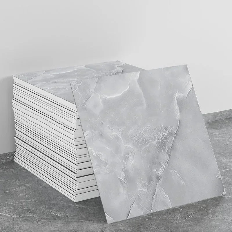 Marble peel-and-stick backsplash wall panel sheets in light gray with soft white veining
