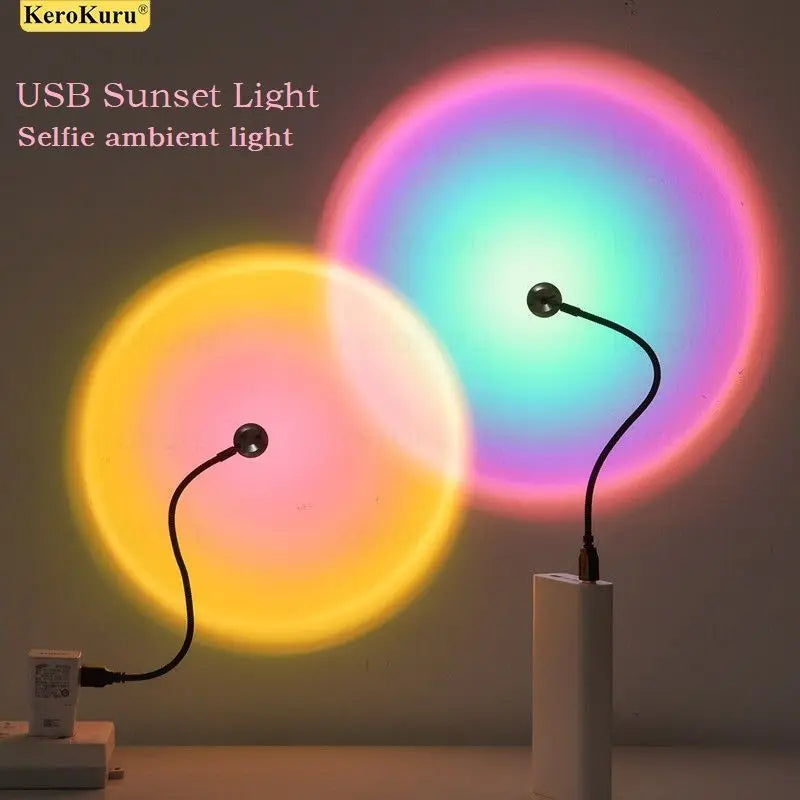 USB sunset lamps on flexible black necks casting circular orange and multicolor gradients on a wall.