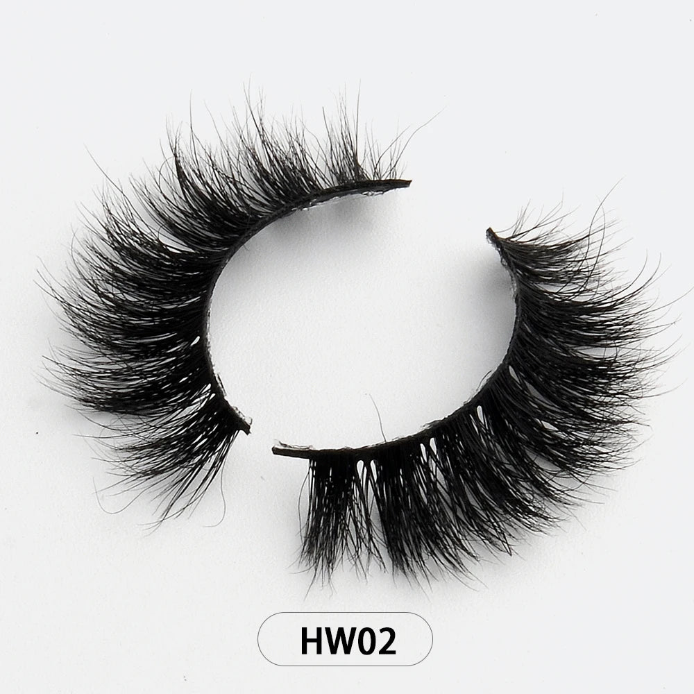 Pair of voluminous, wispy 3D black mink false eyelashes with a flexible band on a white background labeled HW02.