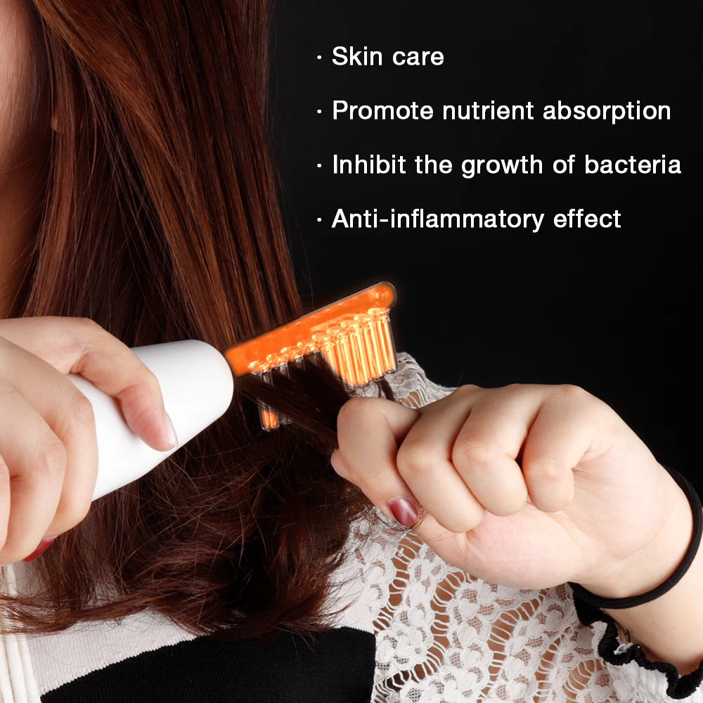 A person uses a high-frequency comb electrode with an orange-glowing glass tube on their brown hair.