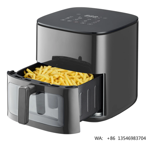 Black air fryer with open drawer and cooking basket filled with fries