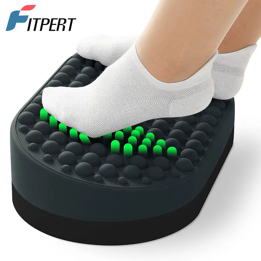 Black ergonomic under desk foot rest with silicone massage nodules for home office plantar fasciitis relief.