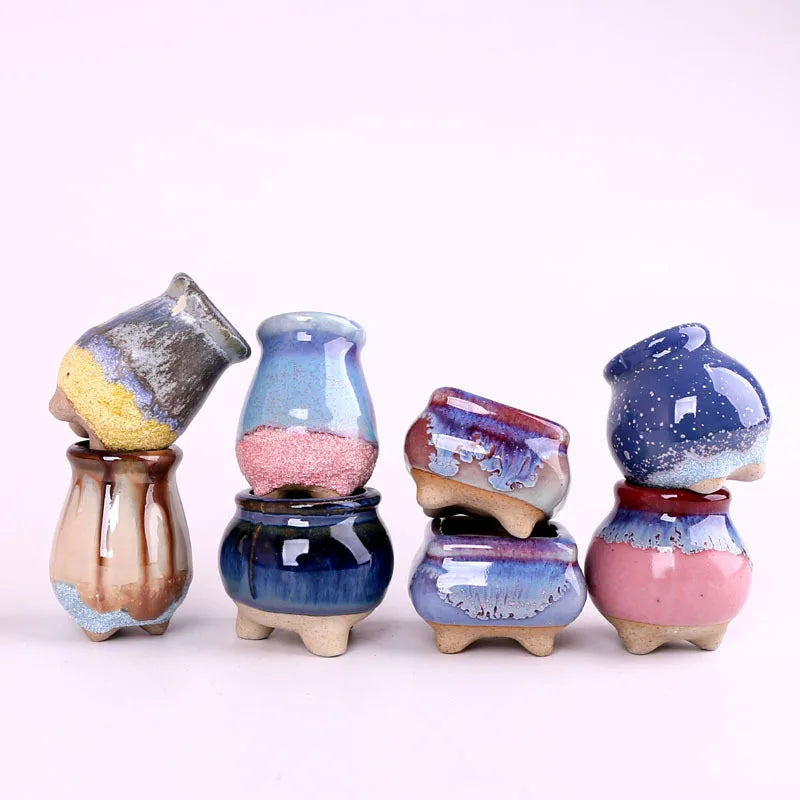 Assorted set of mini ice-crack ceramic succulent pots in blue, pink, purple, and tan