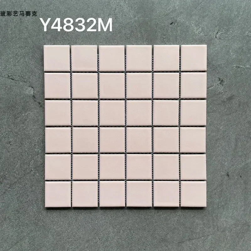 Ceramic mosaic tile sheet with white squares and dark grout lines