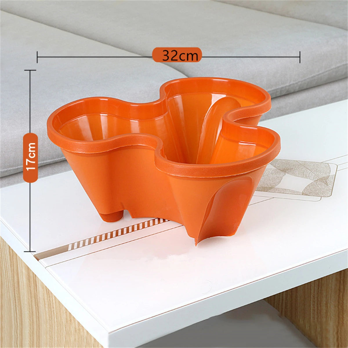 Orange four-petal vertical herb planter with multiple planting wells, stackable pot