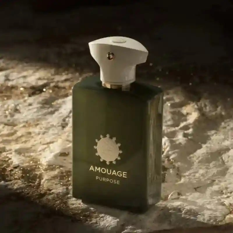 Amouage Purpose men's woody aromatic EDP in a sleek, dark green rectangular bottle with a unique white sculptural cap.