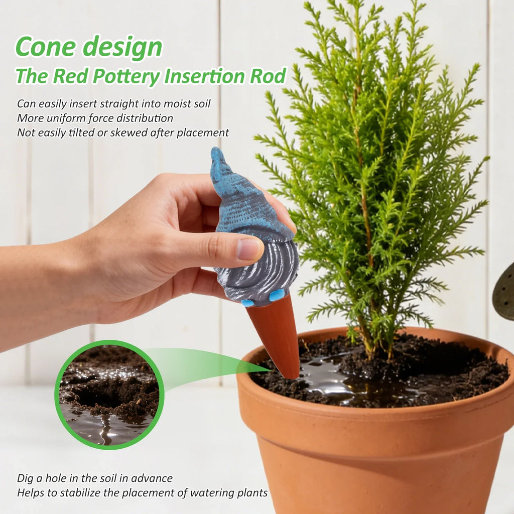 Hand inserting blue ceramic self-watering spike into potting soil in terracotta pot