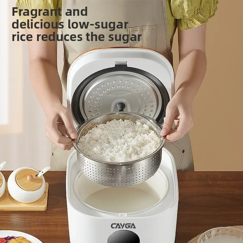 White CAYGA rice cooker with perforated steamer insert and ceramic inner pot open