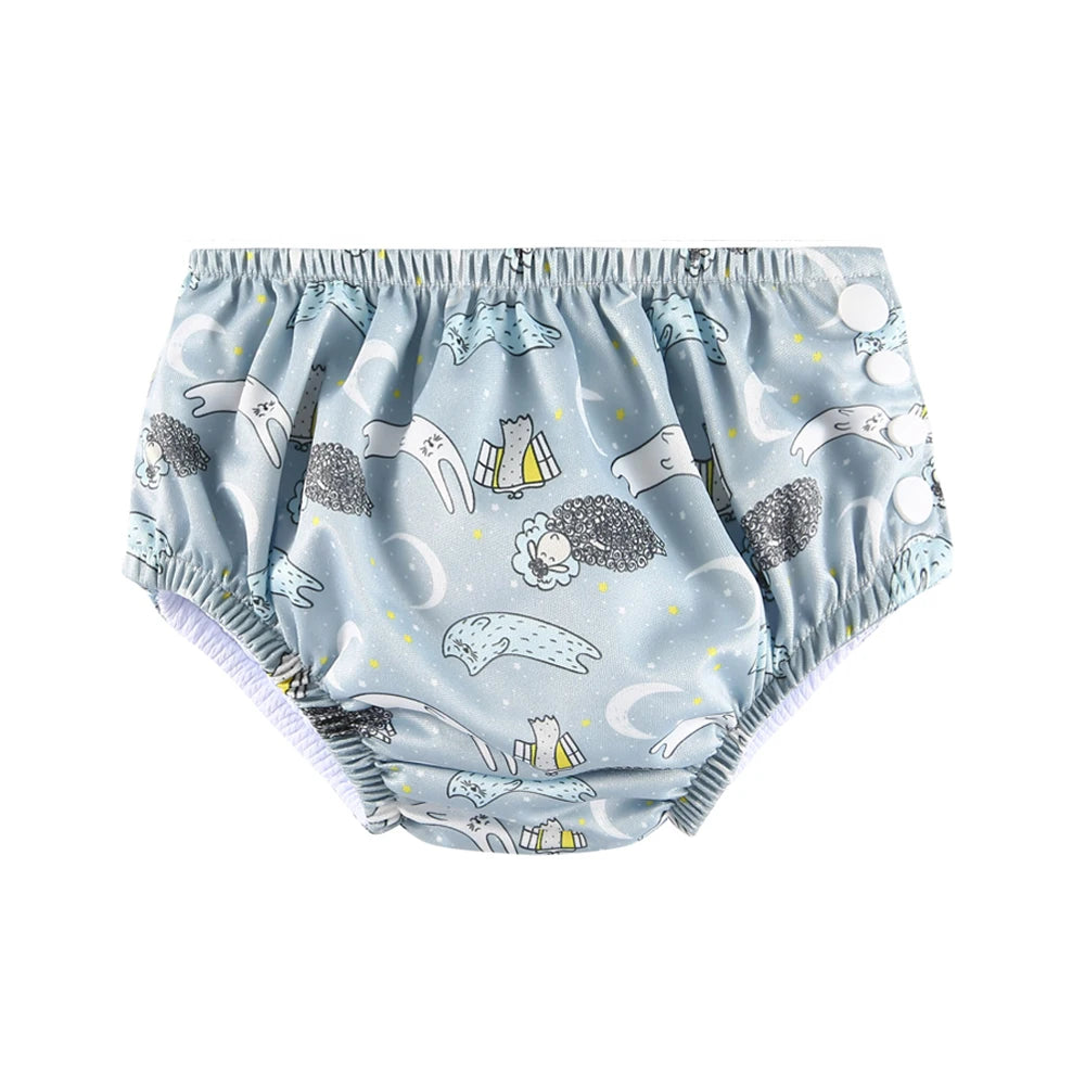 Reusable baby swim diaper in blue with cute sheep and moon print, featuring adjustable side snaps.