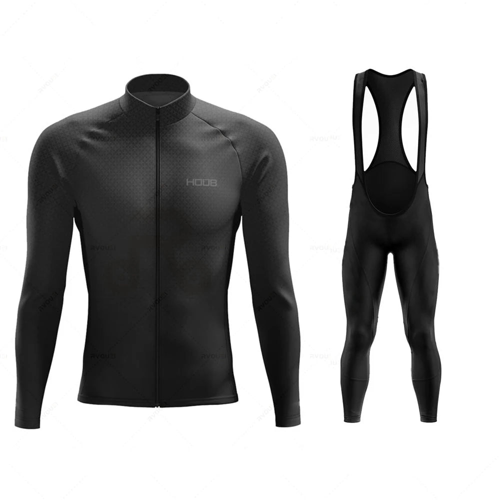 Tidesmit black long-sleeve thermal cycling jersey and bib tights set with a textured pattern and full-length front zip.