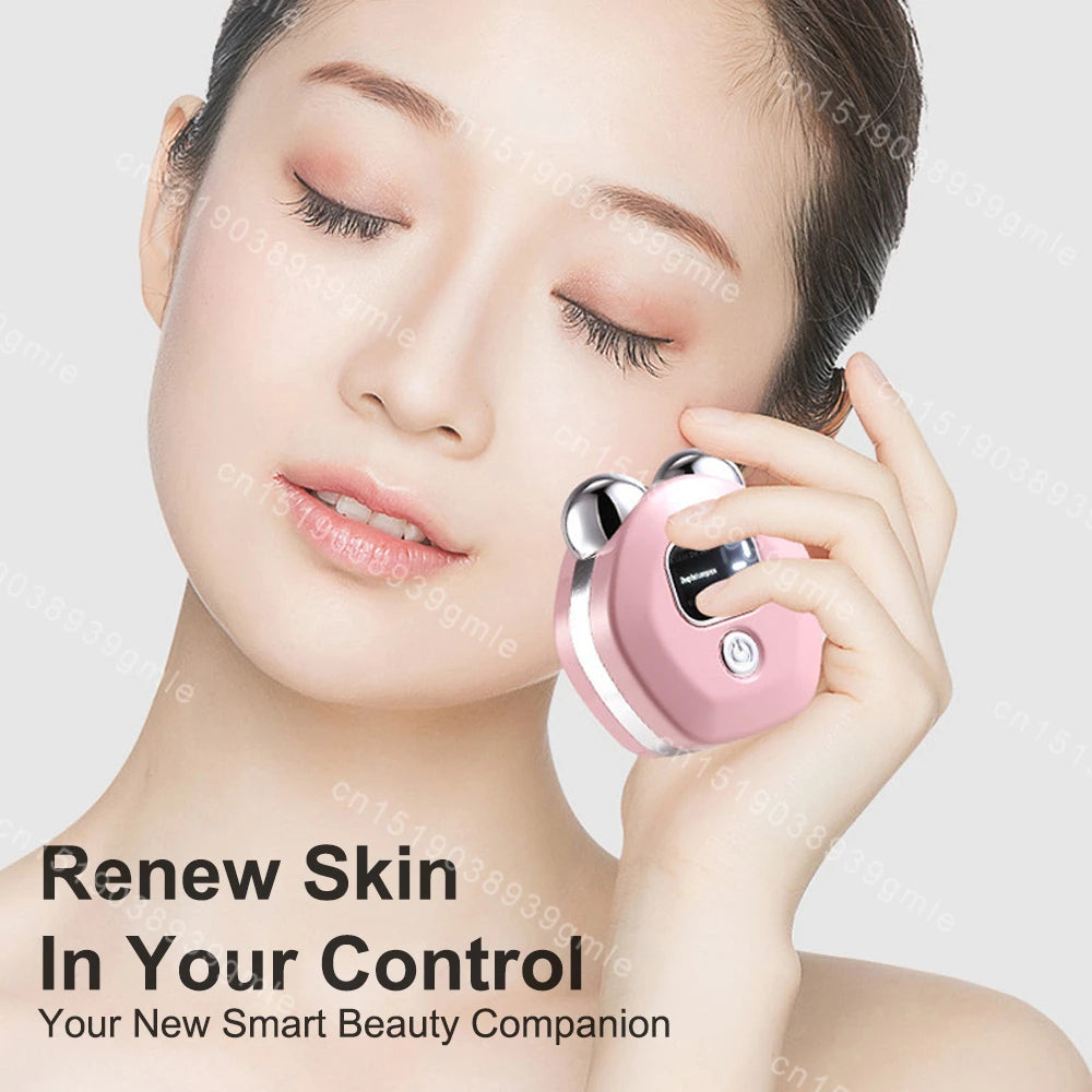 Woman holding a small, pink, ergonomic microcurrent facial massager with two smooth, metallic silver roller heads.