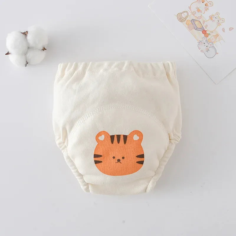 Baby care cloth training diaper with cute tiger print, soft organic cotton design.