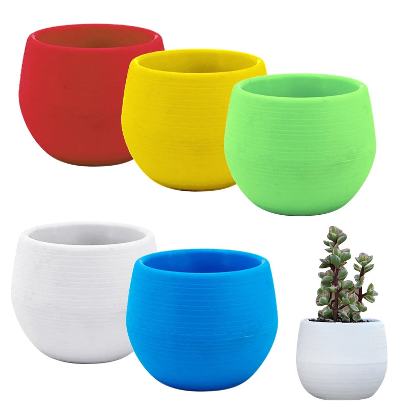 Assorted mini plastic flower pots in red, yellow, green, white, and blue