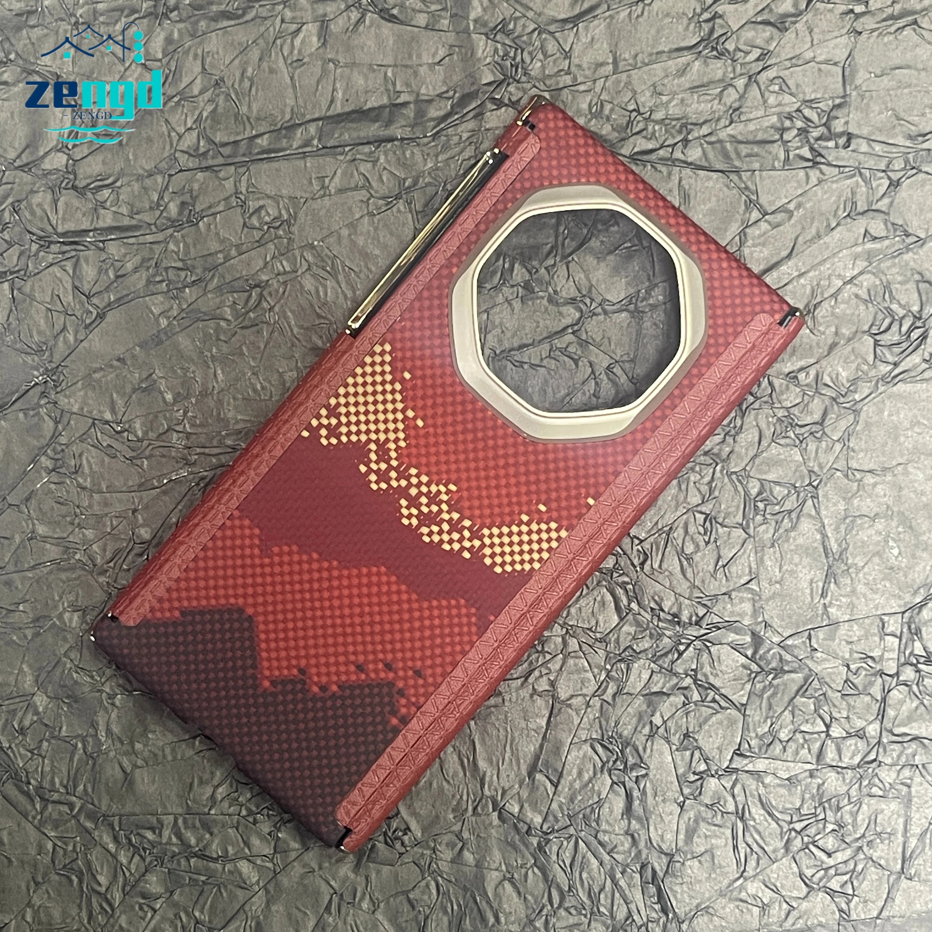 Red and maroon patterned phone case with a large octagonal camera cutout and gold accents on a crinkled grey background.