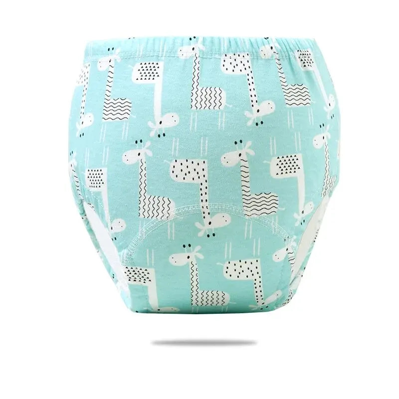 Baby care potty training pants with cute green giraffe print, comfortable cotton diaper alternative for toddlers.