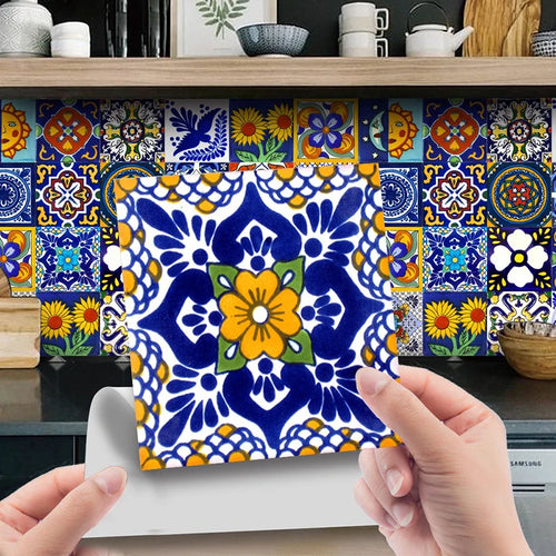 Colorful patterned tile sticker sheet applied to backsplash with hand pointing