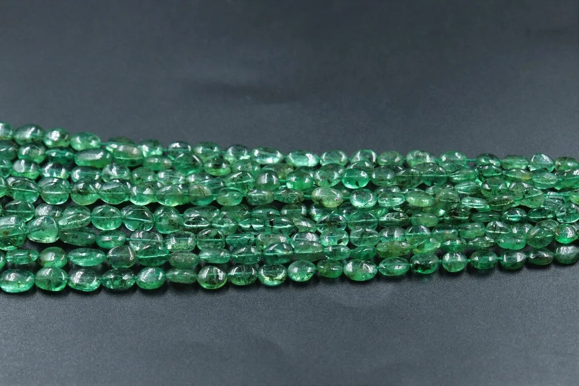 Long strand of green oval beads with glossy surface, jewelry supply