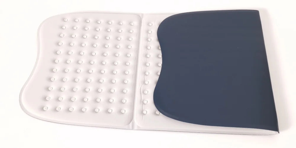 Large red light therapy mat with a white LED-studded surface and a curved dark blue panel on a white background.