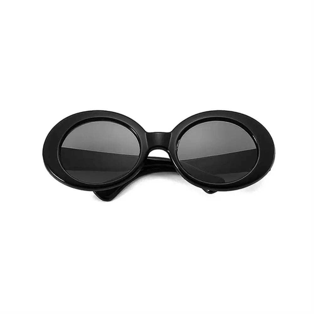 Tidesmit mini black plastic doll sunglasses with thick, oval-shaped frames and dark lenses for Blythe dolls.