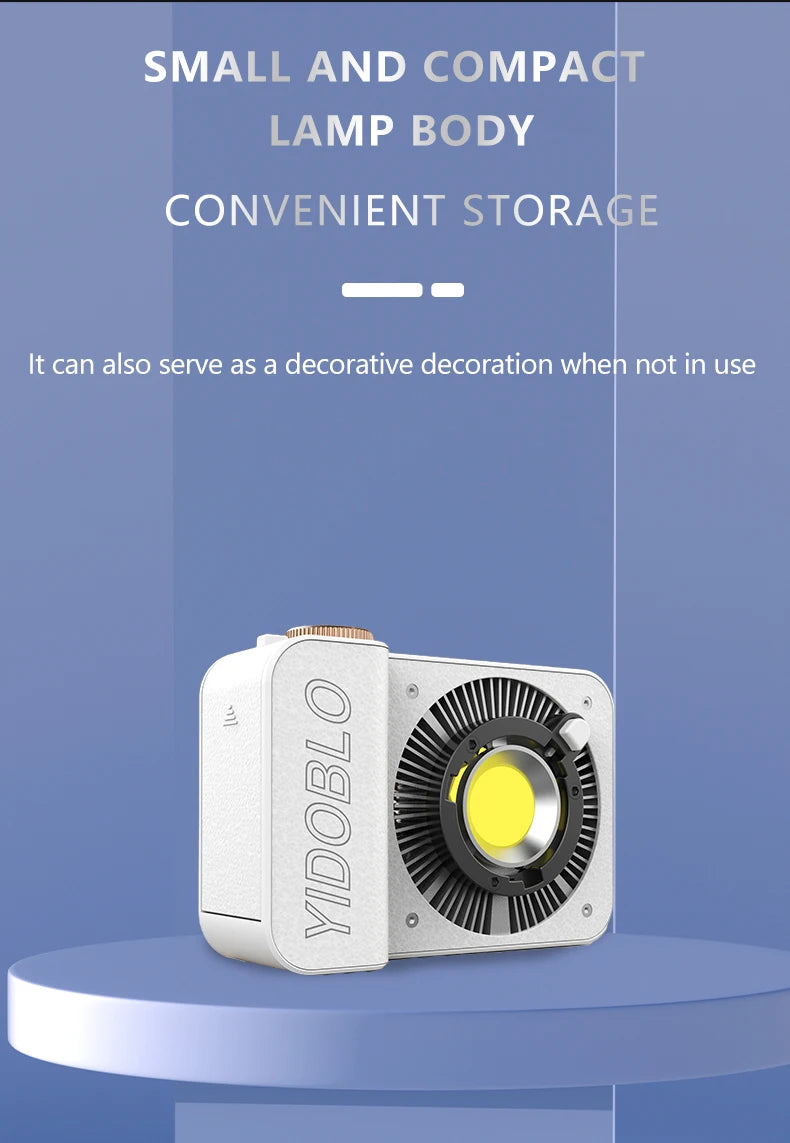 Compact, white rectangular LED video light with a circular black cooling fan and bright yellow light chip.