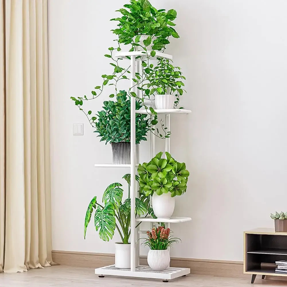 Multi-tier vintage plant display shelf with white frame, round planters on tiered platforms