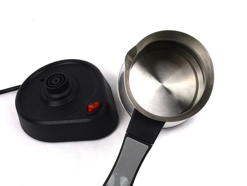Electric Turkish coffee maker with stainless steel pot, black heating base, and power switch on white background.