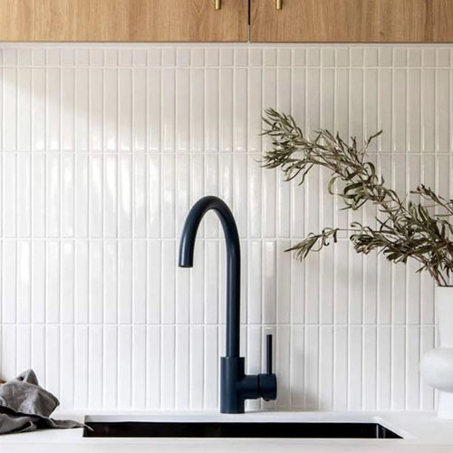 White 3D mosaic peel-and-stick kitchen backsplash tile sheet with raised grid pattern