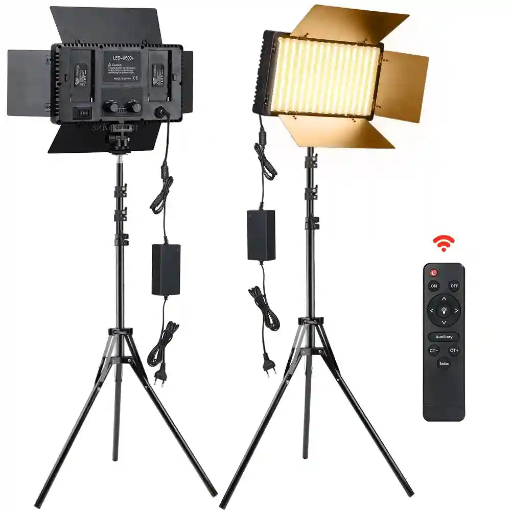 Two rectangular LED studio lights with metal barn doors on adjustable tripod stands, includes a remote control.
